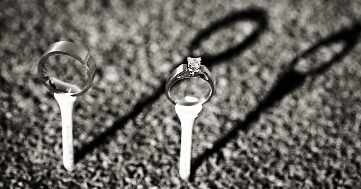 wedding rings on golf tees.