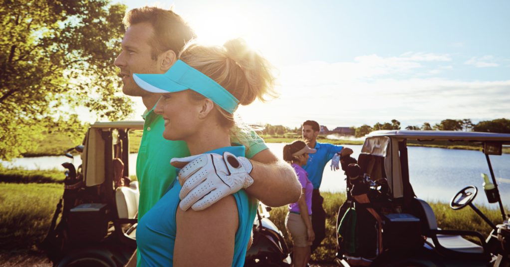 A couple on a golf course.