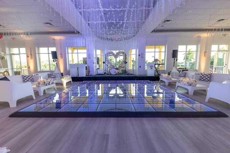 Palm Beach wedding venue with luxury lounge design features, elegant tables and chairs and a modern light up dance floor for an engagement party