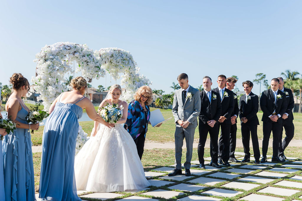 Palm Beach Florida wedding venue ceremony groomsmen in grey suits with waterfront views at a country club wedding venue in Southern Florida